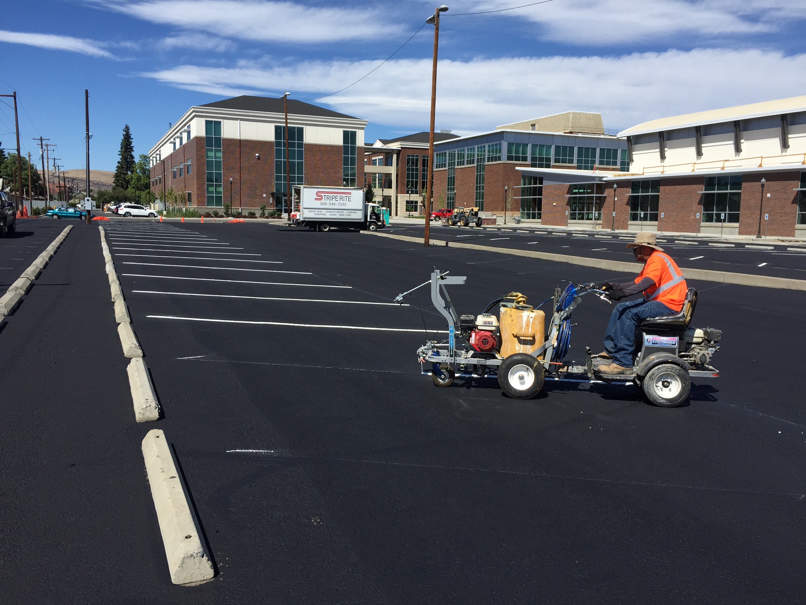So cool to see this in action. This parking lot was worked on by our Yakima Crew with their quality Equipment. Specifically, they installed Wheel Stops, Seal Coated, and Striped.