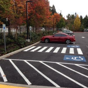 ADA signs, Curbs/Wheel stops, and did Sealcoating and striping.