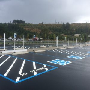ADA signs, Curbs/Wheel stops, and did Sealcoating and striping.