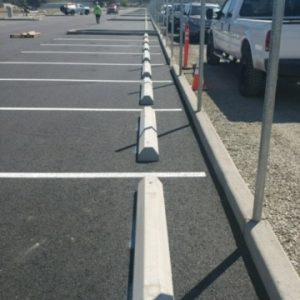 Line of Wheel Stops. As always, Safety, above all, is put first! Lot maintenance is important. Specifically, to keep drivers safe.
